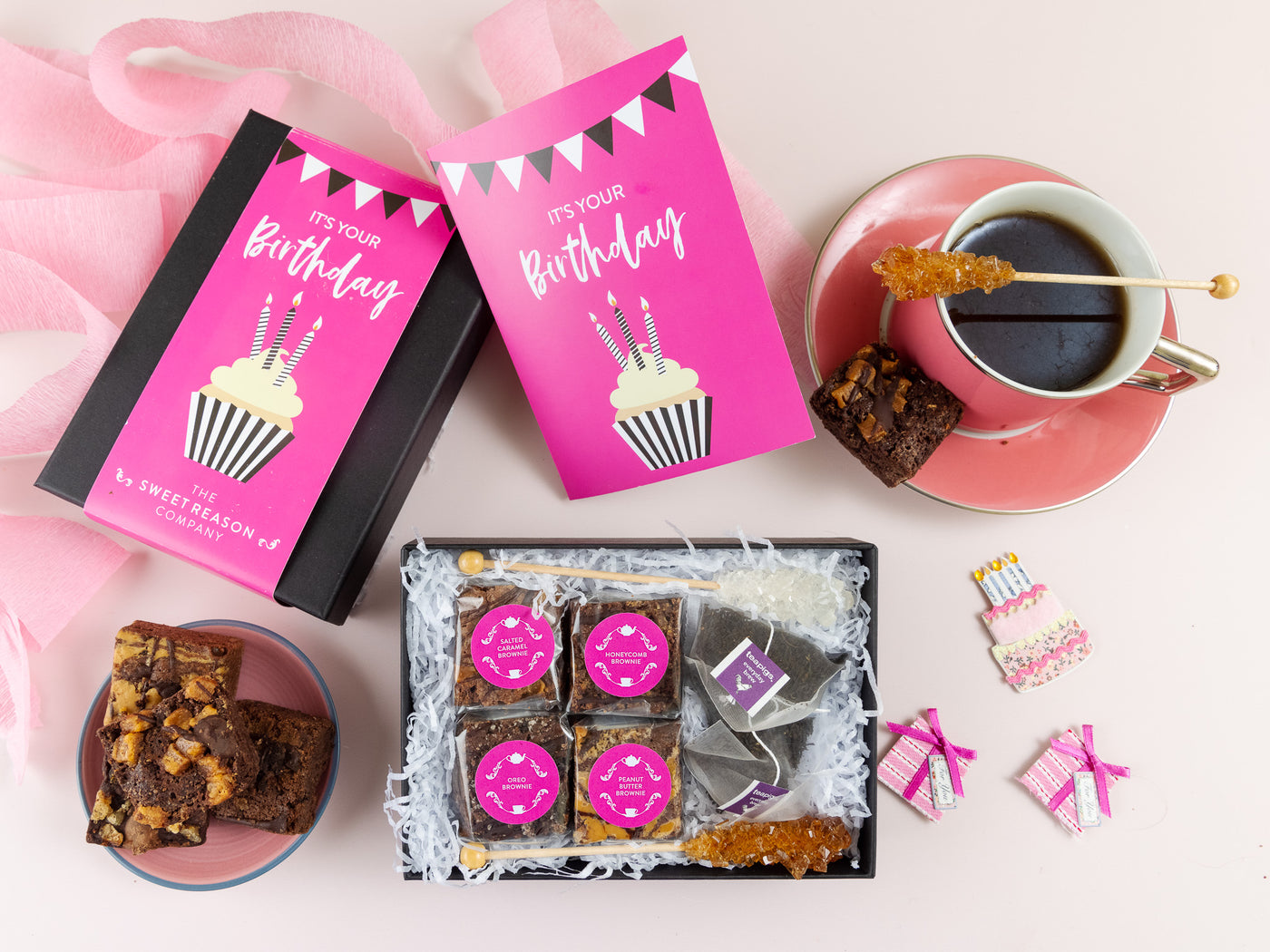Pink Cupcake design Birthday Brownie gift box surrounded by brownies and a cup of tea